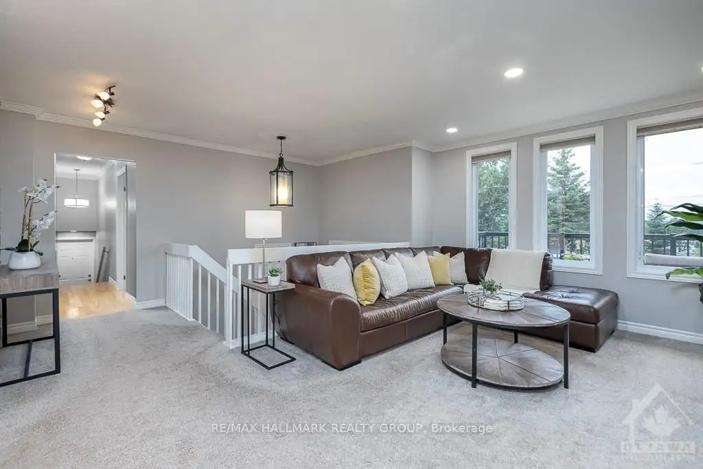 Sunlit family room with freshly painted soft grey walls and crisp white trim